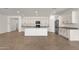 Open-concept kitchen featuring a large island, stainless appliances, and ample cabinet space at 22472 E Sonoqui Blvd, Queen Creek, AZ 85142