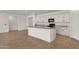 Bright kitchen with granite countertops, center island, and white cabinetry offering ample space at 22472 E Sonoqui Blvd, Queen Creek, AZ 85142