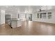 Open-concept kitchen and living area with stainless steel appliances and ample natural light at 22472 E Sonoqui Blvd, Queen Creek, AZ 85142