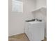 Well-lit laundry room with modern washer and dryer units at 22472 E Sonoqui Blvd, Queen Creek, AZ 85142