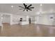 Open concept kitchen and living room with tile flooring and recessed lighting, and black appliances at 22472 E Sonoqui Blvd, Queen Creek, AZ 85142
