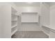 Carpeted walk-in closet with ample storage, shelving, and hanging rods at 22472 E Sonoqui Blvd, Queen Creek, AZ 85142