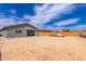 Expansive dirt backyard space, walled and ready for your design ideas; bring your dreams to life at 2458 N Abbey Rd, Casa Grande, AZ 85122