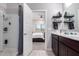 Bathroom showcasing a modern shower, sleek vanity, and views to the main bedroom at 2458 N Abbey Rd, Casa Grande, AZ 85122