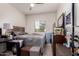 Bedroom with a ceiling fan, window, a dresser and a workspace at 2458 N Abbey Rd, Casa Grande, AZ 85122