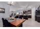 Open concept dining room with seamless flow to the living room and kitchen at 2458 N Abbey Rd, Casa Grande, AZ 85122