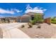 Charming home featuring a three-car garage, neutral paint, and desert landscaping at 2458 N Abbey Rd, Casa Grande, AZ 85122