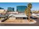 Expansive aerial view of the cozy one-story home with city views and a palm tree lined street at 2544 E Elm St, Phoenix, AZ 85016