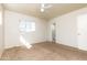 Well-lit bedroom with natural light and neutral paint and flooring at 2544 E Elm St, Phoenix, AZ 85016