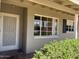 Inviting front porch with a storm door and a view of the well-maintained landscaping around the property at 2544 E Elm St, Phoenix, AZ 85016