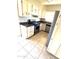 Well-lit kitchen with stainless steel appliances and white cabinets at 2544 E Elm St, Phoenix, AZ 85016