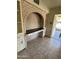 This charming home office features a cozy brick wall and built in cabinets at 2544 E Elm St, Phoenix, AZ 85016