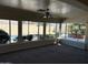 Bright sun room with large windows overlooking the backyard pool area at 2544 E Elm St, Phoenix, AZ 85016