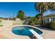 Inviting in-ground pool with diving board surrounded by lush landscaping, creating a private backyard oasis at 2544 E Elm St, Phoenix, AZ 85016