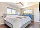 Bedroom with large windows, ceiling fan, and hardwood floors at 2715 E Edgemont Ave, Phoenix, AZ 85008