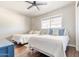 Bright bedroom with two beds, dark wood floor and ceiling fan at 2715 E Edgemont Ave, Phoenix, AZ 85008
