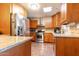 Kitchen featuring wooden cabinets, granite countertops and stainless steel appliances at 2715 E Edgemont Ave, Phoenix, AZ 85008