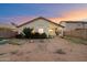 Spacious backyard featuring a covered patio and drought tolerant landscaping at 3015 S Woodruff Dr, Mesa, AZ 85212
