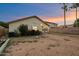 Spacious backyard featuring a covered patio and drought tolerant landscaping at 3015 S Woodruff Dr, Mesa, AZ 85212