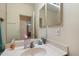 Bright bathroom featuring a single sink with a towel bar and vanity mirror at 3015 S Woodruff Dr, Mesa, AZ 85212