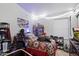 Fun bedroom with a gaming chair, novelty decor, and natural light at 3015 S Woodruff Dr, Mesa, AZ 85212