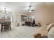 Open-concept dining area offering tile floors and plenty of natural light and a ceiling fan at 3015 S Woodruff Dr, Mesa, AZ 85212