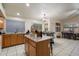 Bright and airy kitchen featuring tile floors, a center island, and ample counter space at 3015 S Woodruff Dr, Mesa, AZ 85212