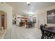 Spacious kitchen featuring tile floors, a center island, wood cabinets and bright lighting at 3015 S Woodruff Dr, Mesa, AZ 85212