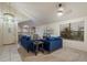 Inviting living room with vaulted ceilings, a comfortable blue sofa and plenty of natural light at 3015 S Woodruff Dr, Mesa, AZ 85212
