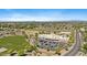 Expansive aerial shot of a neighborhood, highlighting community amenities and abundant tree coverage in the area at 345 N Scott Dr, Chandler, AZ 85225