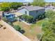 Aerial view of a spacious backyard with a pool, trampoline, and plenty of green space for Gathering fun and relaxation at 345 N Scott Dr, Chandler, AZ 85225