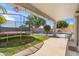 Outdoor patio features a covered area, trampoline, outdoor furniture, and beautiful pool at 345 N Scott Dr, Chandler, AZ 85225