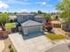 Charming house exterior displaying a well-kept lawn, stylish gray paint, stone accents, and modern design at 345 N Scott Dr, Chandler, AZ 85225