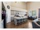 Bright kitchen features an island with bar seating, stainless steel appliances, and wood-look flooring at 345 N Scott Dr, Chandler, AZ 85225