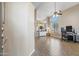 Bright living room featuring vaulted ceilings, wood-look flooring, and an open layout at 345 N Scott Dr, Chandler, AZ 85225