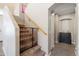 Staircase with carpeted steps, wooden handrail, and a safety gate at 345 N Scott Dr, Chandler, AZ 85225