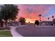 Picturesque street scene with vibrant sunset, showcasing the peaceful and inviting neighborhood atmosphere at 345 N Scott Dr, Chandler, AZ 85225