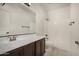 Bathroom features a vanity with a sink and a shower/tub combo with tiled floors at 3530 S Bandit Rd, Gilbert, AZ 85297