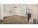 Upper landing with neutral paint and carpet, ceiling fan, and railing views at 3530 S Bandit Rd, Gilbert, AZ 85297
