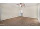 Large bedroom with carpet, a ceiling fan, and neutral paint at 3530 S Bandit Rd, Gilbert, AZ 85297