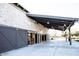 Covered entrance to the building featuring large doors and modern architectural details at 3530 S Bandit Rd, Gilbert, AZ 85297
