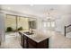 Kitchen island featuring granite countertops and stainless steel sink at 3530 S Bandit Rd, Gilbert, AZ 85297