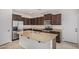 Modern kitchen with granite countertops, stainless steel appliances, and dark wood cabinetry at 3530 S Bandit Rd, Gilbert, AZ 85297