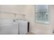 Laundry room featuring a side-by-side washer and dryer and a large window at 3530 S Bandit Rd, Gilbert, AZ 85297