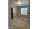 Comfortable bedroom features neutral gray walls, plush carpeting, and a classic window at 3539 W Davidson Ln, Phoenix, AZ 85051