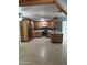 Bright kitchen featuring wooden cabinets, modern stainless steel appliances, and tile flooring at 3539 W Davidson Ln, Phoenix, AZ 85051