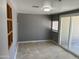Bright living room features neutral walls and tile flooring, complemented by sliding glass doors at 3539 W Davidson Ln, Phoenix, AZ 85051