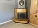 Living room boasts stylish fireplace, neutral tile flooring, and accent lighting at 3539 W Davidson Ln, Phoenix, AZ 85051