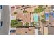 An aerial shot showcasing backyard pool, lush greenery, and neighborhood rooftops at 3608 W Harrison St, Chandler, AZ 85226