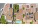 A high-angle shot revealing the layout of homes, highlighting well-kept lawns and neat landscaping at 3608 W Harrison St, Chandler, AZ 85226